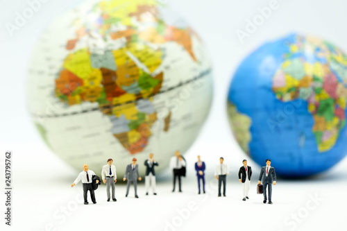 Miniature people : Businessman team with miniworld ,International business concept.