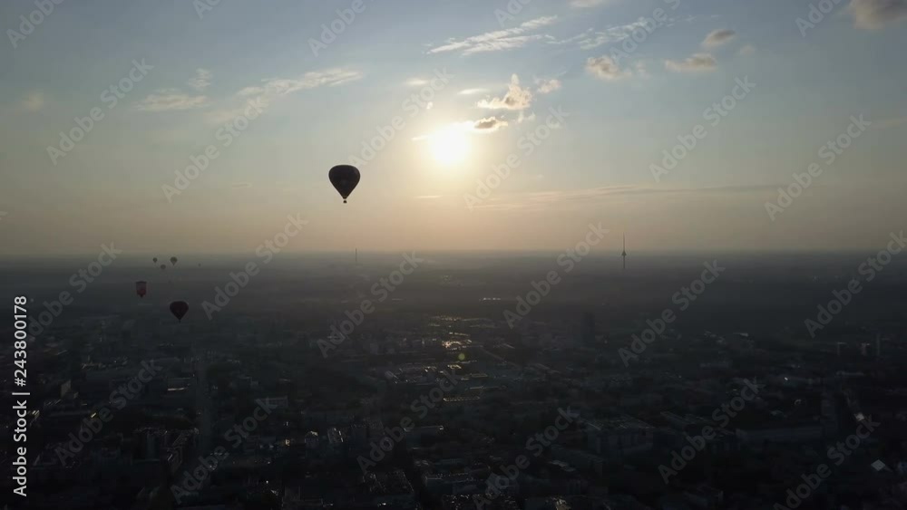 Aerial view of hot air balloons over Vilnius city, Lithuania. Hot air balloons floating over city at dawn. Aerial view of hot air balloons over Vilnius city, Lithuania. Hot air balloons floating over city at dawn.