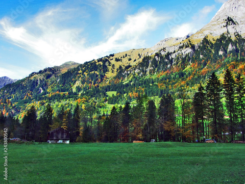 Rocky peak Sulzberg in the Glarus Alps mountain range and above Lake Klontalersee - Canton of Glarus, Switzerland photo