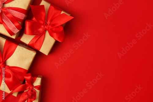Wrapped presents with bright red background with copy space