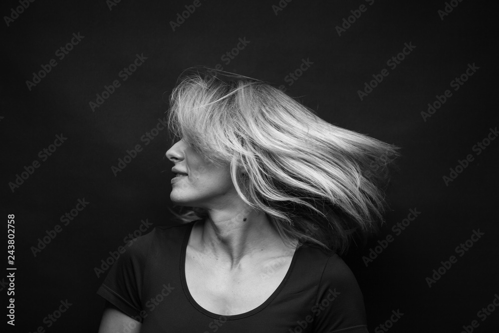 Dramatic black and white portrait of a beautiful woman on a dark background Dramatic black and white portrait of a beautiful woman on a dark background