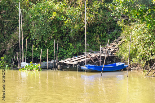 Small boats at shore of parana chao phraya river in Thailand.