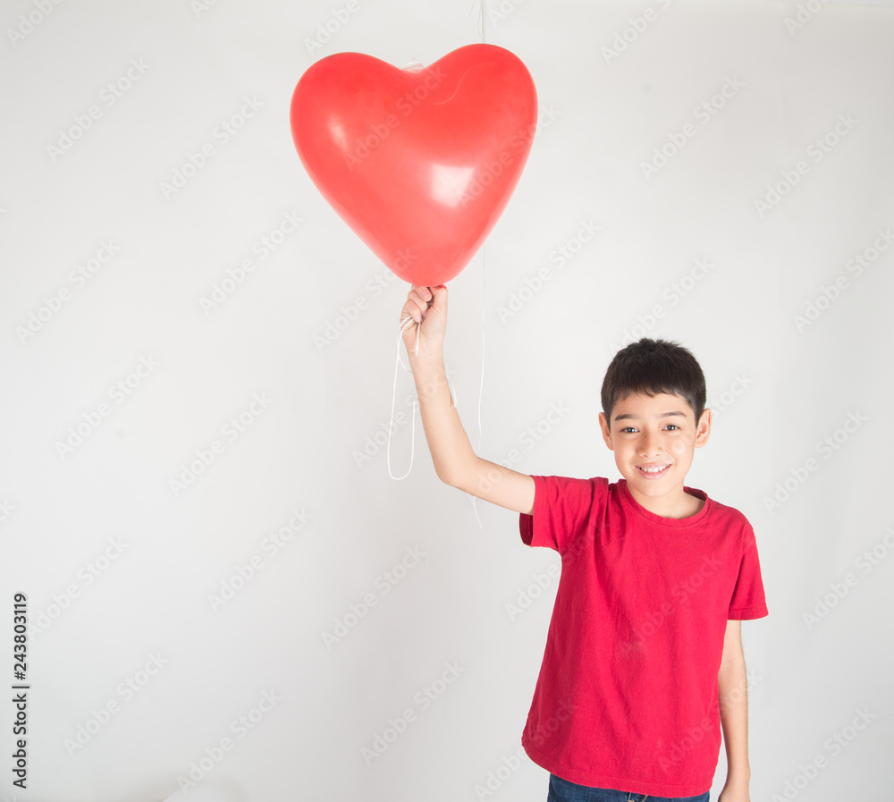 Boy sibling with balloon heart shape of love Boy sibling with balloon heart shape of love