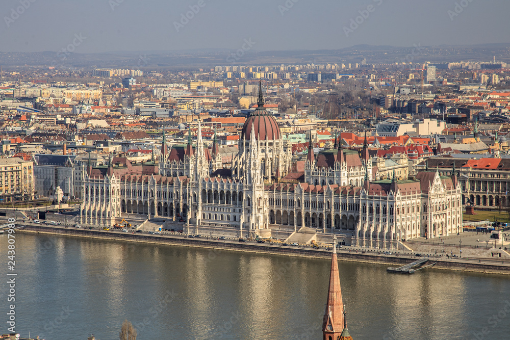 A landscape view of Budapest city in the evening, the Hungarian parliament building and otherr buildings along Danube river, Hungary