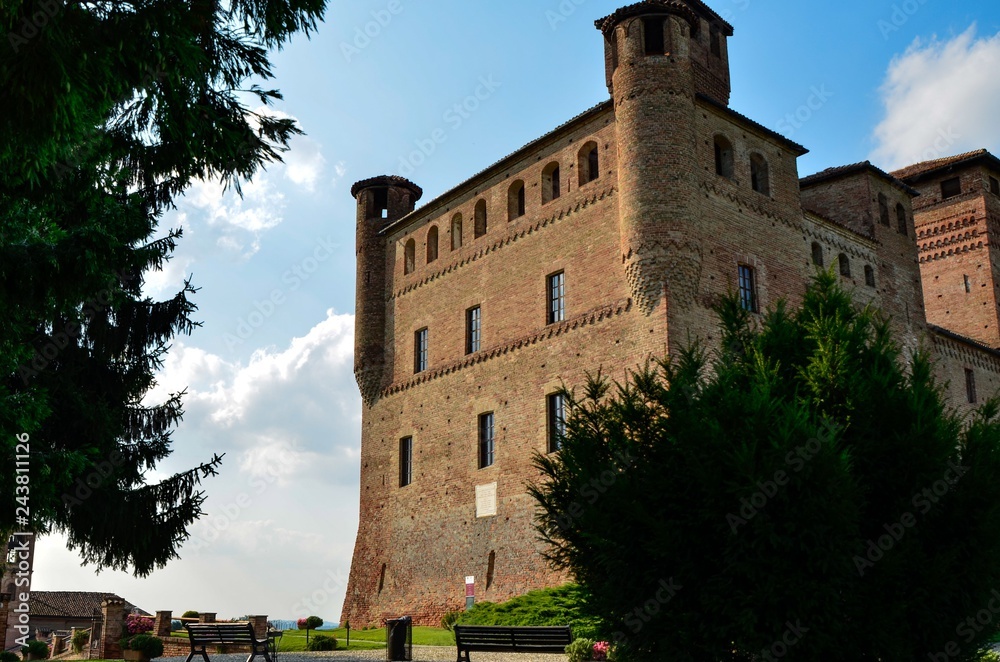 Grinzane Cavour, Piedmont, Italy. July 2018. The majestic castle made of red bricks. Grinzane Cavour, Piedmont, Italy. July 2018. The majestic castle made of red bricks.