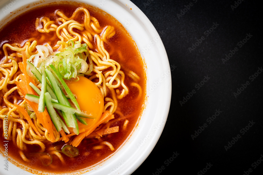korean spicy instant noodles with egg, vegetable and kimchi