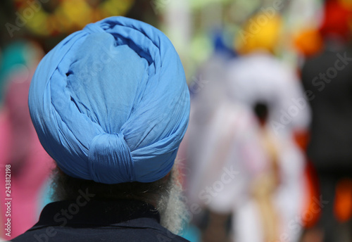 Senior bearded Sikh religion man with turbaned during the religious ceremony photo