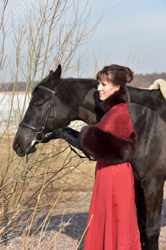 woman in vintage suit with horse