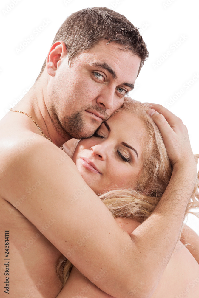 Fototapeta premium Beautiful loving couple, nude, hugging and kissing, close-up, isolated on white background