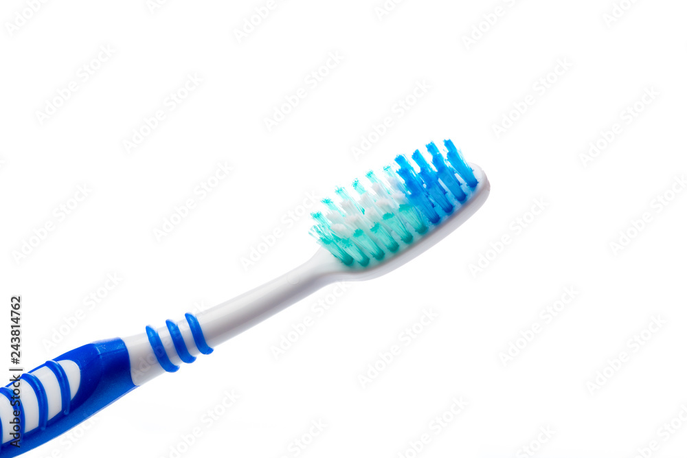 colored toothbrush on an isolated background, close up colored toothbrush on an isolated background, close up