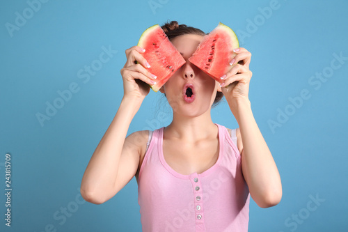 Obraz na płótnie beautiful girl smiling and eating fresh red watermelon