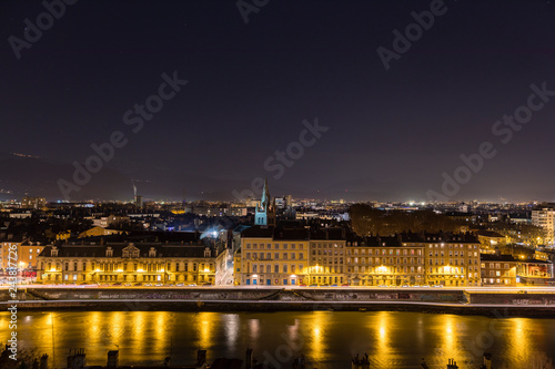 Grenoble, France, January 2019 : City at night with isere river © florent