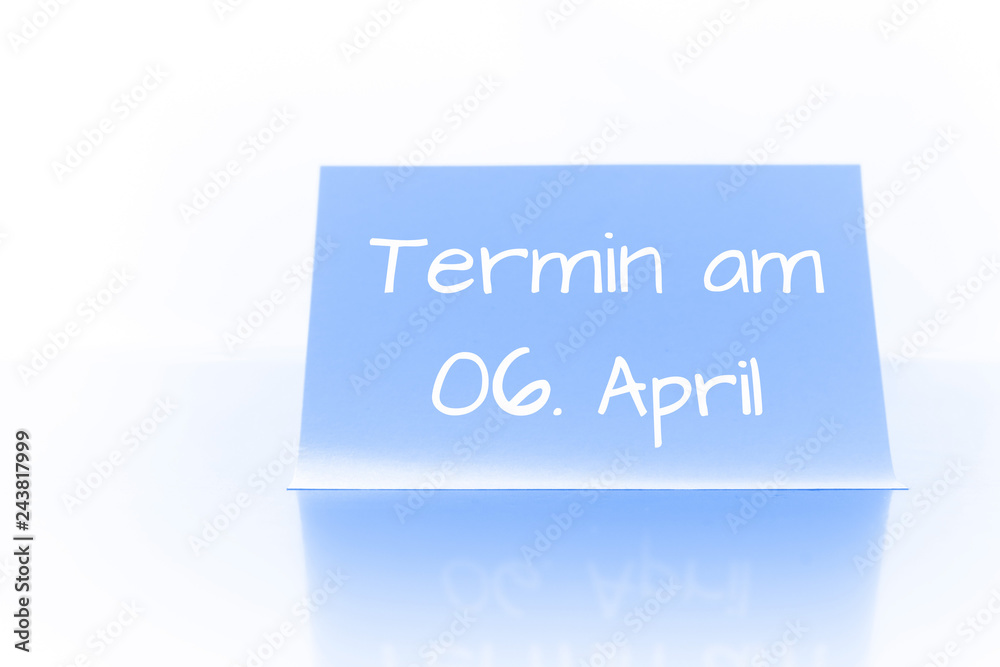 Termin am 6. April - blauer Zettel mit Notiz Termin am 6. April - blauer Zettel mit Notiz