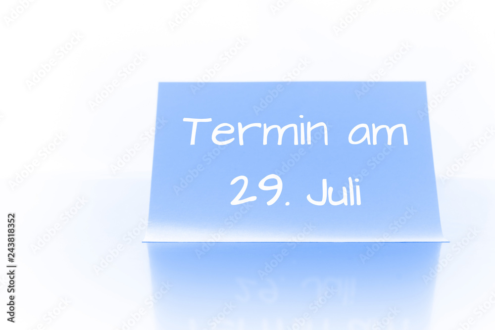 Termin am 29. Juli - blauer Zettel mit Notiz Termin am 29. Juli - blauer Zettel mit Notiz