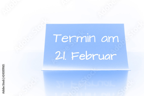 Termin am 21. Februar - blauer Zettel mit Notiz