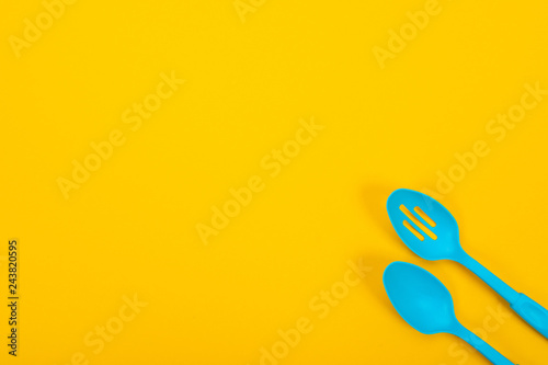 Design concept of kitchen utensils isolated on yellow background