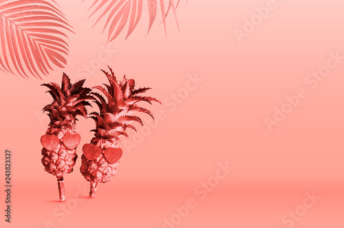Summer tropical concept design of Pineapples wearing sunglasses on Pantone Color of the Year 2019 Living Coral