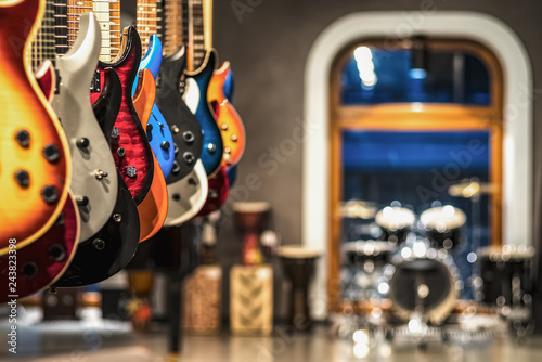 guitars, showcase with guitars hanging in a row