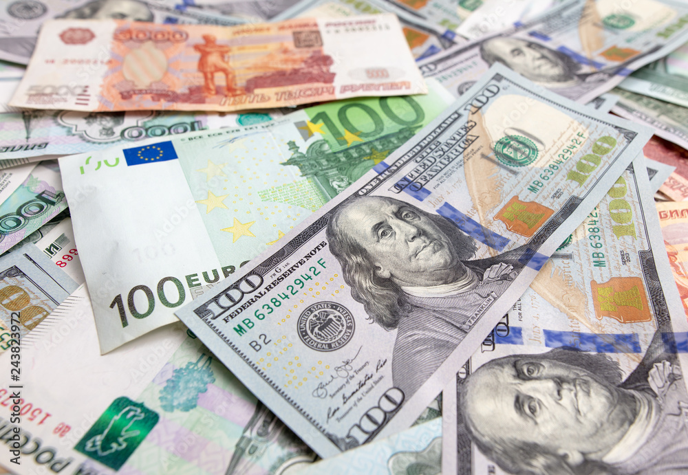 Dollars and Russian rubles. Euro on the table as background Dollars and Russian rubles. Euro on the table as background