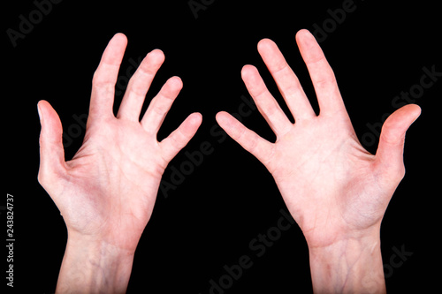 expressive slender skinny female hands in various poses on a black background