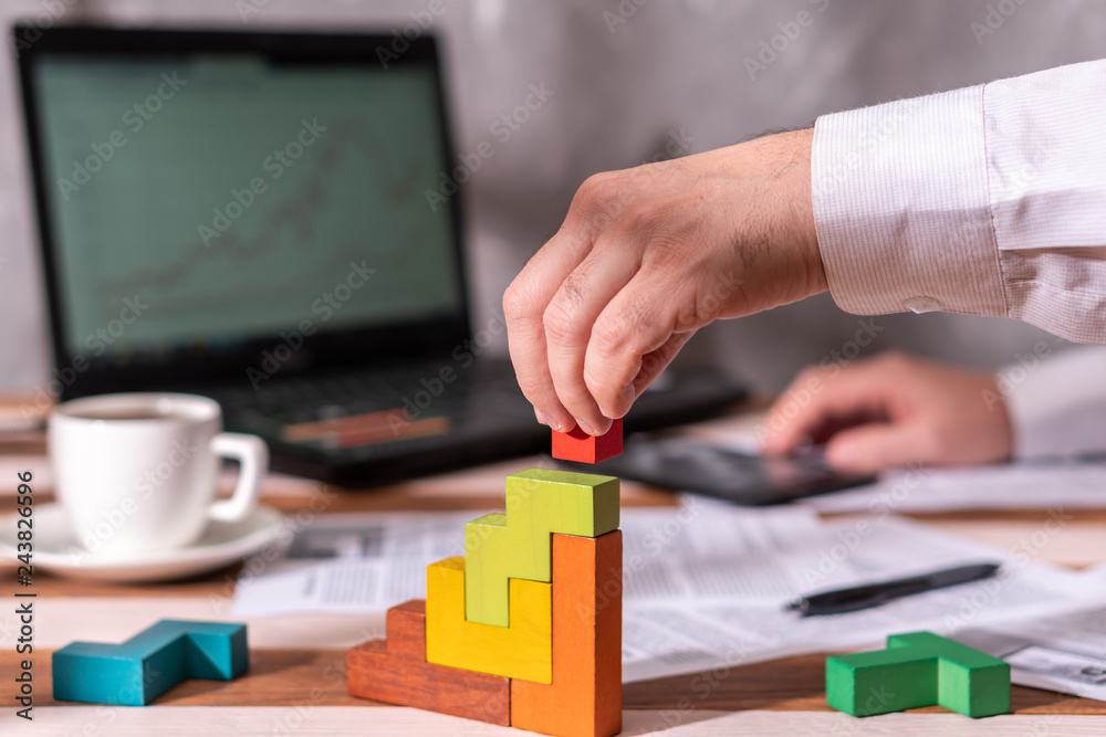 Fototapeta premium Businessman with conundrum at table in office.