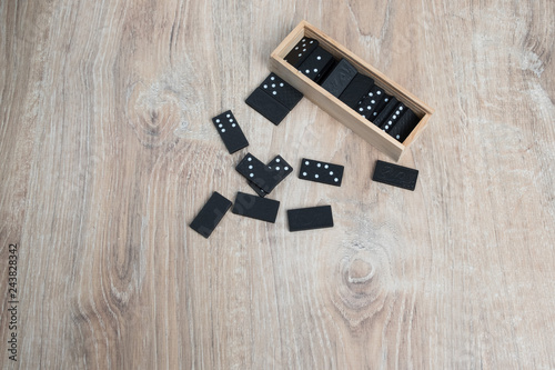 Domino game. Dominoes on a wooden table.