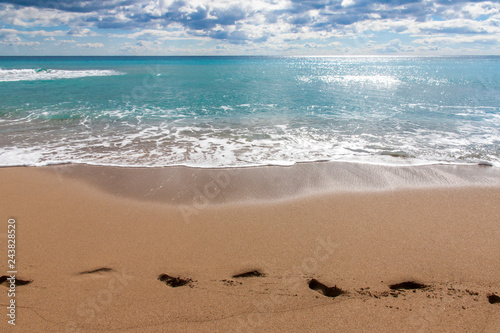 beach, sea and footprints