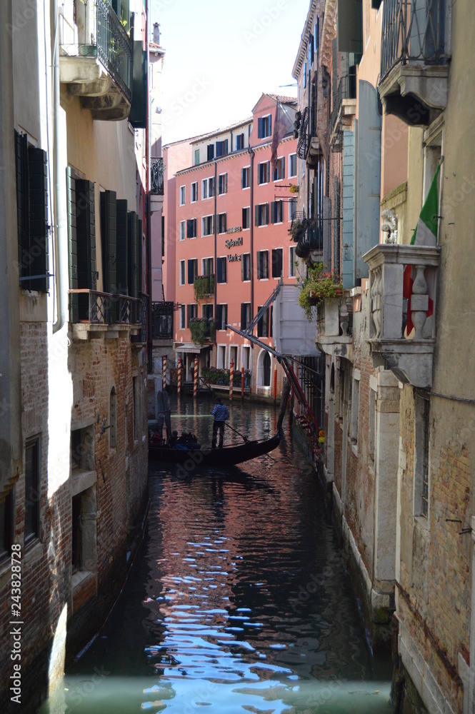 Narrow Canals With A Gondola Sailing In Venice. Travel, Holidays, Architecture. March 27, 2015. Venice, Region Of Veneto, Italy.