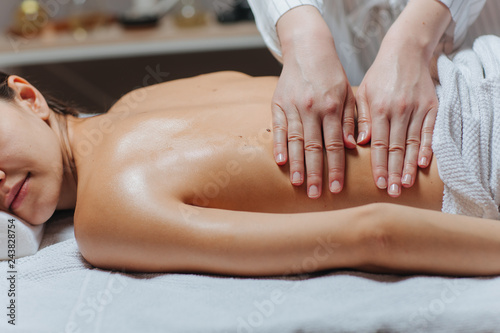 Woman Enjoying a Back Massage .