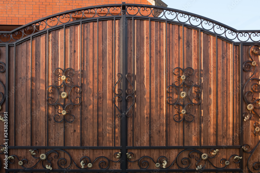 Metal wrought iron gates. Part of the vintage wrought iron gate