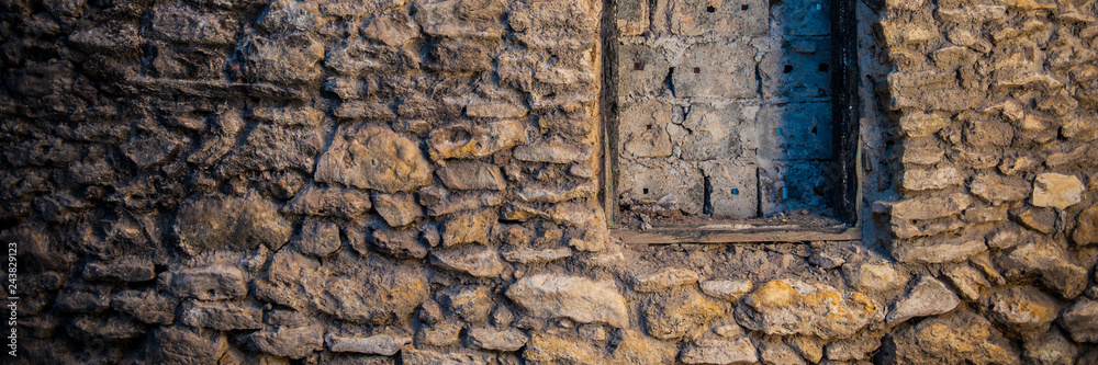 Fototapeta premium stone wall of an old house. Banner for design.