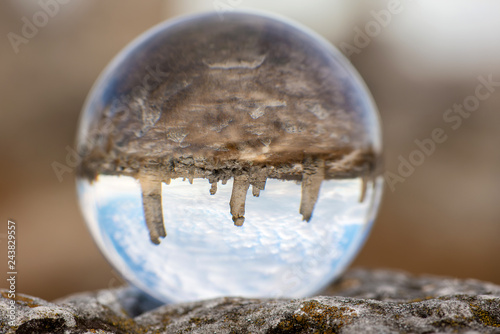 Upside down landscape of Pobiti Kamani  The Stone Forest Natural Reserve near Varna in Bulgaria  Eastern Europe - reflection in a lens ball - selective focus  space for text