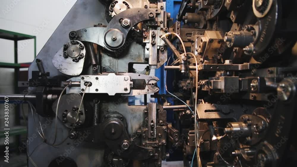 CNC equipment for the production of compression springs, cylindrical screw springs. Process of manufacturing springs for stretching. CNC equipment for the production of compression springs, cylindrical screw springs. Process of manufacturing springs for stretching.