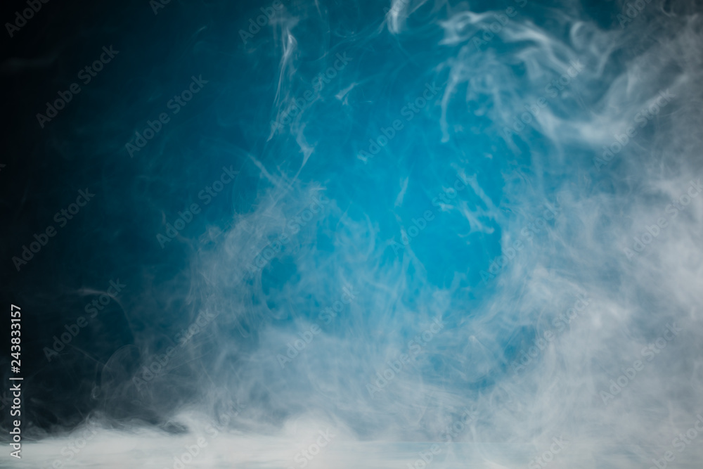 Fototapeta premium dense smoke on blue background