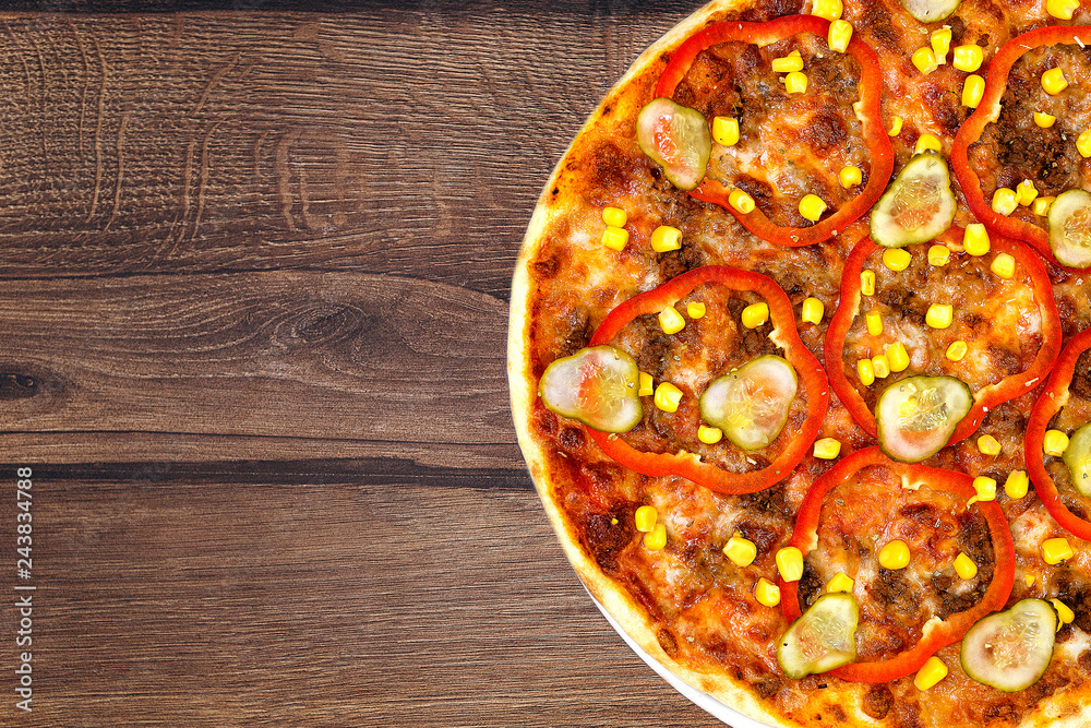 Tasty delicious fresh pizza on plate on wooden background. Photo for menu, italian food concept Tasty delicious fresh pizza on plate on wooden background. Photo for menu, italian food concept