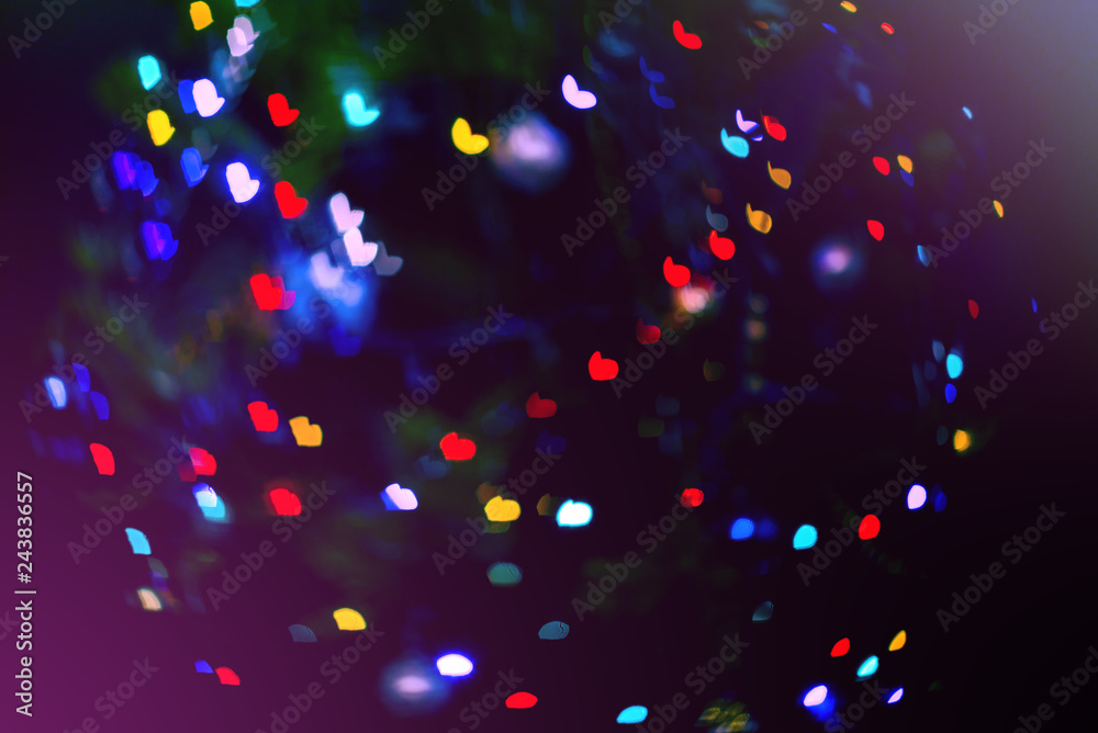 Abstract colorful background with heart-shaped bokeh. Blue, purple, green, red colors. Abstract colorful background with heart-shaped bokeh. Blue, purple, green, red colors.