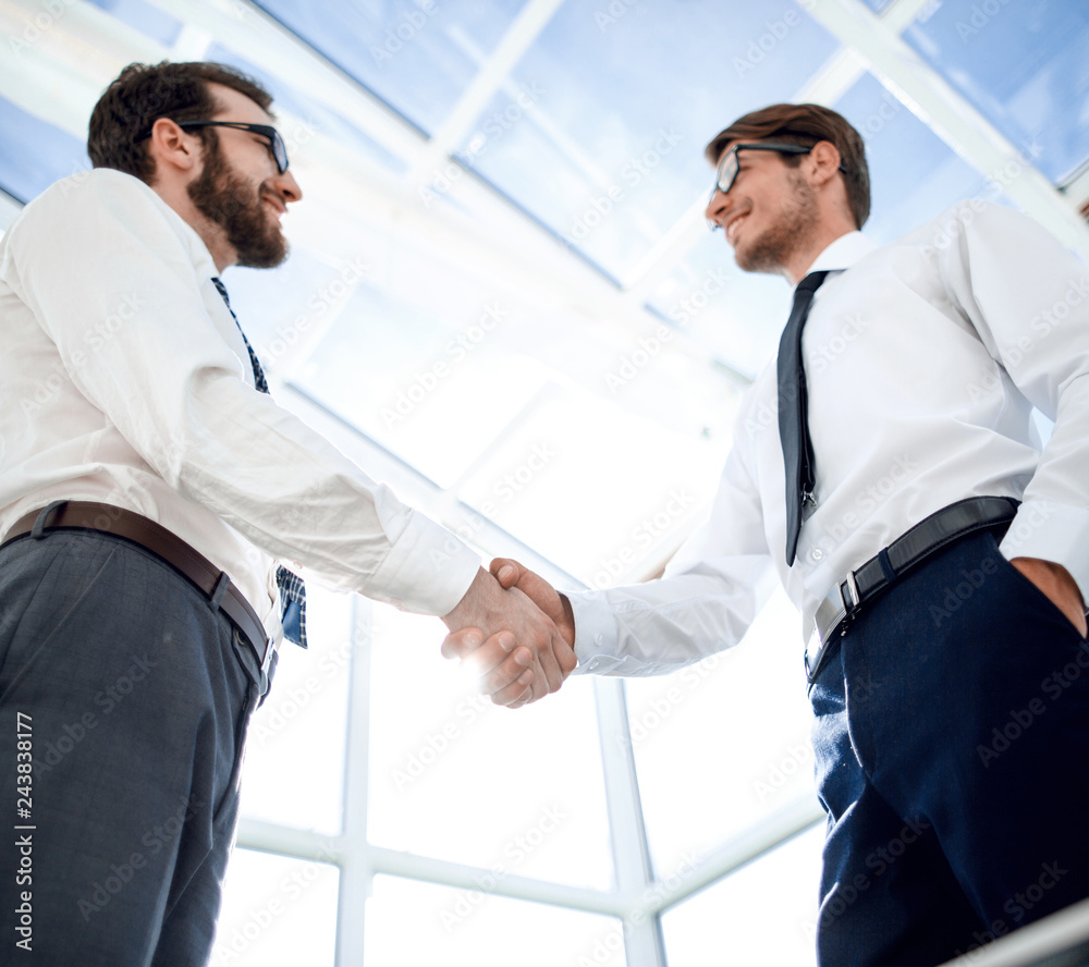 bottom view.handshake business people standing in the office bottom view.handshake business people standing in the office