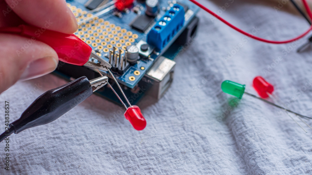 Red and green LED lights being shown in use as part of a ...