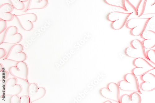 Wreath frame mockup made of paper heart symbols on white background. Flat lay, top view Valentines Day background love concept.
