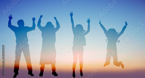 Success of teamwork collaboration and freedom on silhouette sunset background. business concept.