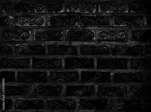 Beautiful ornamental classic style of brick wall pattern background, traditional pattern of black square painted block decorated with vine shape background, black vintage wall for decoration