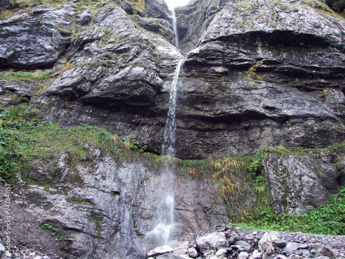 Seasonal waterfalls in the Valley of Lake Klontalersee - Canton of Glarus, Switzerland photo