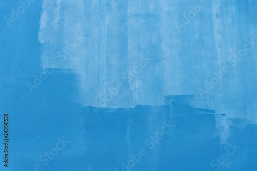 Abstract background from blue brush stroke painted on concrete wall. Vintage and retro art backdrop.