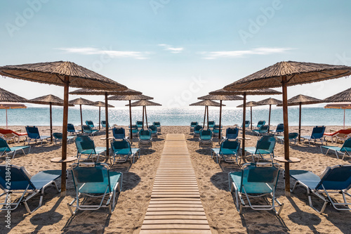 Beach With Lounge chairs and Umbrellas © Kurt Pacaud