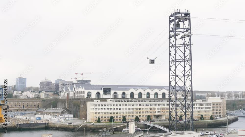 The Brest cable car is an urban cable car between the two banks of the Penfeld, a coastal river that flows through Brest and separates the Siam and Capucin districts. Cloudy weather. The Brest cable car is an urban cable car between the two banks of the Penfeld, a coastal river that flows through Brest and separates the Siam and Capucin districts. Cloudy weather.