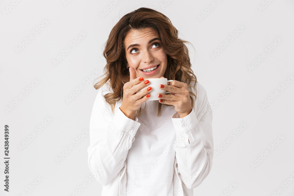 Happy young woman holding cup with tea Happy young woman holding cup with tea