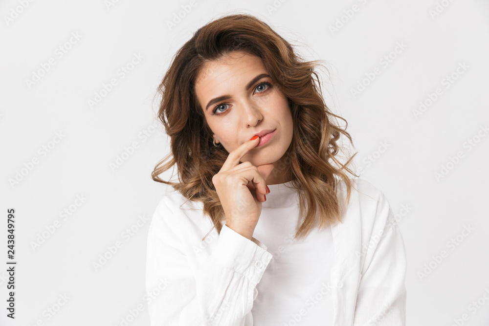Portrait of beautiful brunette woman in casual clothes standing, isolated over white background Portrait of beautiful brunette woman in casual clothes standing, isolated over white background