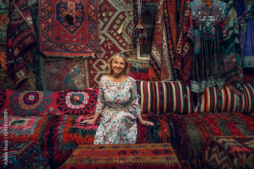 Girl in old carpet shop in Cappadocia