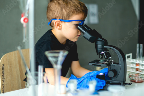 Preschooler using microscope