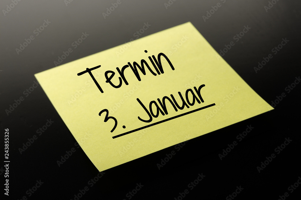Termin 3. Januar - gelber Notizzettel dunkler Hintergrund Termin 3. Januar - gelber Notizzettel dunkler Hintergrund